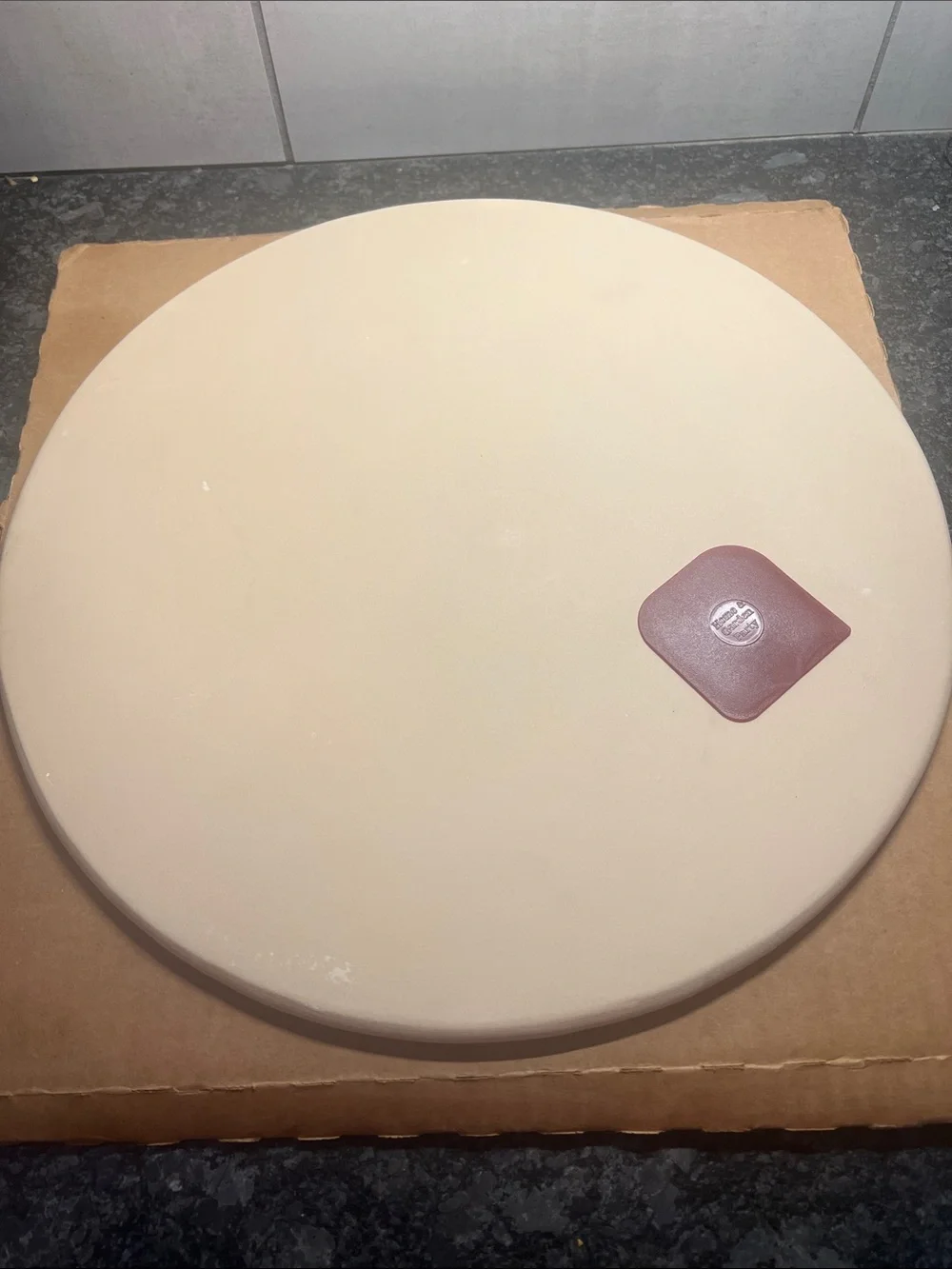 Home & Garden Party 14 1/2” new in box round pizza stone.